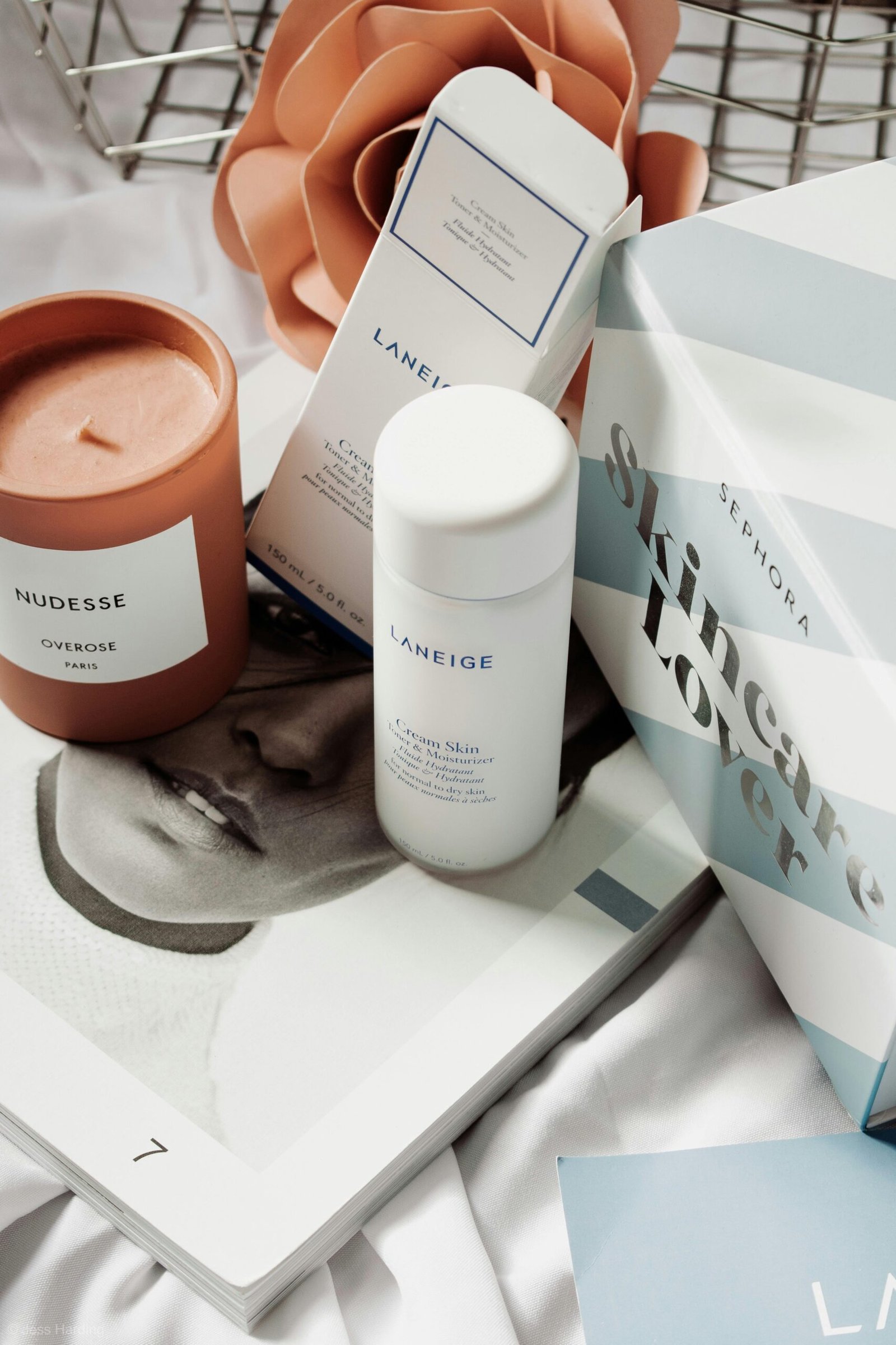 Array of Korean skincare products arranged for a visually appealing display, highlighting their ingredients that target hyperpigmentation and promote even skin tone.