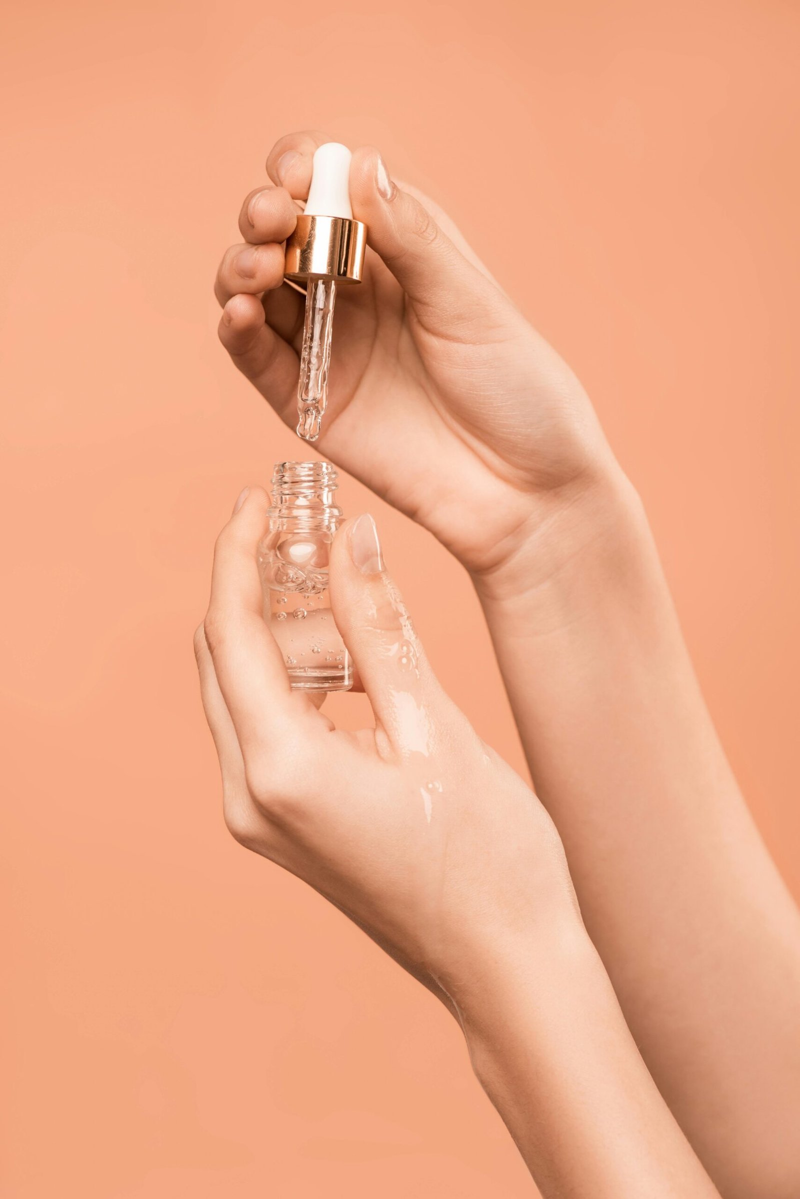 Close-up of a facial serum bottle highlighting texture and packaging in the context of serum vs toner skincare comparison.